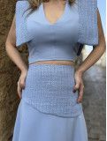 Conjunto de fiesta de dos piezas formado por top y falda. Conjunto de fiesta de dos piezas formado por top y falda.