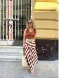 Falda midi de vuelo con estampado de rayas beige y marrón. Falda midi de vuelo con estampado de rayas beige y marrón.